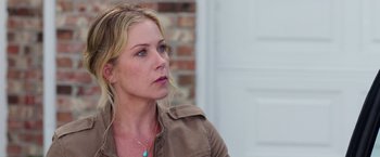 Movie still from “Vacation” (2015), directed by John Francis Daley – A beautiful blonde woman wearing a brown jacket; Close Up shot, Over the shoulder angle