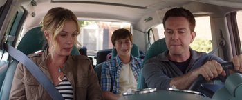 Movie still from “Vacation” (2015), directed by John Francis Daley – A man and a woman and a boy sitting in the back of a van; Medium shot, Over the shoulder angle
