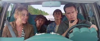 Movie still from “Vacation” (2015), directed by John Francis Daley – A group of young men sitting in the back seat of a car; Medium shot, Over the shoulder angle