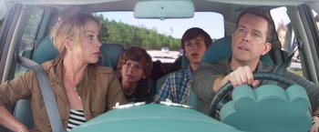 Movie still from “Vacation” (2015), directed by John Francis Daley – A group of people in the back seat of a car; Medium shot, Over the shoulder angle