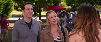 Movie still from “Vacation” (2015), directed by John Francis Daley – A woman and a man are walking in a park; Medium shot, Over the shoulder angle