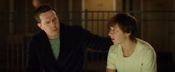 Movie still from “Vacation” (2015), directed by John Francis Daley – A man and a woman sitting next to each other in front of a railing; Close Up shot, Over the shoulder angle