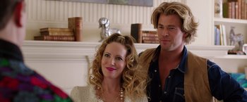 Movie still from “Vacation” (2015), directed by John Francis Daley – A man and a woman sitting next to each other in a room; Medium shot, Over the shoulder angle