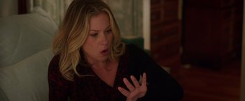 Movie still from “Vacation” (2015), directed by John Francis Daley – A woman is sitting in a chair and holding her hand up to her mouth; Close Up shot, Over the shoulder angle