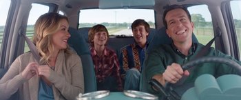 Movie still from “Vacation” (2015), directed by John Francis Daley – A group of people sitting in the back of a car; Medium shot, Over the shoulder angle
