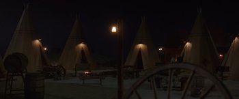 Movie still from “Vacation” (2015), directed by John Francis Daley – Two teepees are lit up at night in the desert; Extreme Wide shot, High angle
