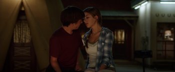 Movie still from “Vacation” (2015), directed by John Francis Daley – A man and a woman sitting next to each other; Medium shot, Over the shoulder angle