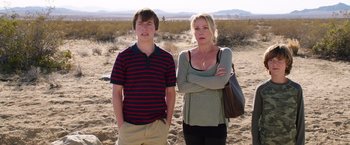 Movie still from “Vacation” (2015), directed by John Francis Daley – A woman and a young boy standing in the desert; Medium shot, Low angle