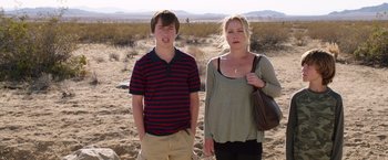 Movie still from “Vacation” (2015), directed by John Francis Daley – A woman and a young boy standing in the desert; Medium shot, Low angle