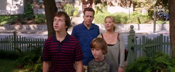 Movie still from “Vacation” (2015), directed by John Francis Daley – A group of people standing next to each other in front of a tree; Medium shot, Over the shoulder angle