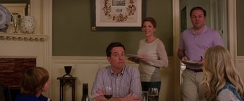 Movie still from “Vacation” (2015), directed by John Francis Daley – A man and a woman are standing at a dinner table; Medium shot, Over the shoulder angle