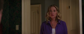 Movie still from “Vacation” (2015), directed by John Francis Daley – A woman standing in a room looking at the camera; Close Up shot, Over the shoulder angle
