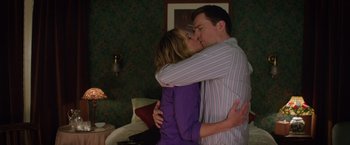 Movie still from “Vacation” (2015), directed by John Francis Daley – A man and a woman kissing in a living room; Medium shot, Low angle