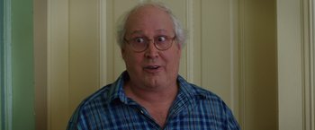 Movie still from “Vacation” (2015), directed by John Francis Daley – An older man with a surprised look on his face; Close Up shot, Over the shoulder angle