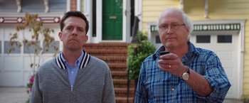 Movie still from “Vacation” (2015), directed by John Francis Daley – Two men standing next to each other in front of a house; Medium shot, Low angle