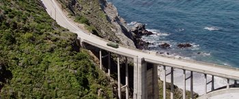 Movie still from “Vacation” (2015), directed by John Francis Daley – An aerial view of a bridge over the ocean; Extreme Wide shot, High angle