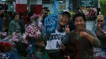 Movie still from “Valentine's Day” (2010), directed by Garry Marshall – A couple of people that are standing in the street; Medium shot, Over the shoulder angle