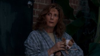 Movie still from “Valentine's Day” (2010), directed by Garry Marshall – A woman holding a small brown and white dog; Close Up shot, Over the shoulder angle