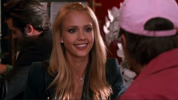 Movie still from “Valentine's Day” (2010), directed by Garry Marshall – A beautiful blonde woman smiling at the camera; Close Up shot, Over the shoulder angle
