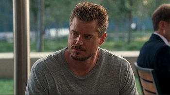 Movie still from “Valentine's Day” (2010), directed by Garry Marshall – A person wearing a gray t - shirt; Close Up shot, Over the shoulder angle