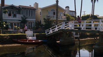 Movie still from “Valentine's Day” (2010), directed by Garry Marshall – Two people on a boat in the water near a bridge; Extreme Wide shot, High angle