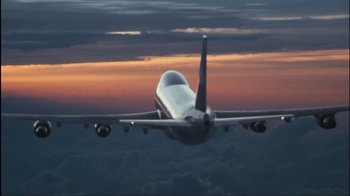 Movie still from “Valentine's Day” (2010), directed by Garry Marshall – An airplane is flying through the air at sunset; Extreme Wide shot, Low angle