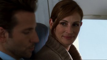 Movie still from “Valentine's Day” (2010), directed by Garry Marshall – A person sitting next to another person; Close Up shot, Over the shoulder angle