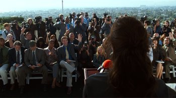 Movie still from “Valentine's Day” (2010), directed by Garry Marshall – A group of people sitting in front of an audience; Wide shot, Over the shoulder angle