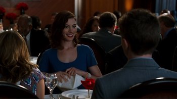 Movie still from “Valentine's Day” (2010), directed by Garry Marshall – A woman sitting at a dinner table with a man; Medium shot, Over the shoulder angle
