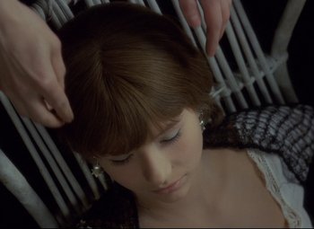 Movie still from “Valerie and Her Week of Wonders” (1970), directed by Jaromil Jires – A woman getting her hair combed by a stylist; Close Up shot, Overhead angle