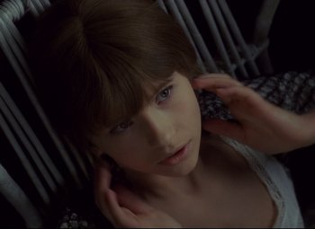 Movie still from “Valerie and Her Week of Wonders” (1970), directed by Jaromil Jires – A young woman with her hands on her head; Close Up shot, High angle