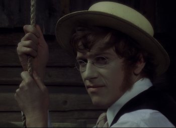 Movie still from “Valerie and Her Week of Wonders” (1970), directed by Jaromil Jires – A young man wearing a hat and a tie; Close Up shot, High angle