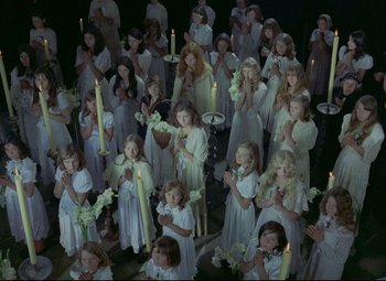 Movie still from “Valerie and Her Week of Wonders” (1970), directed by Jaromil Jires – A large group of little girls holding candles; Wide shot, High angle