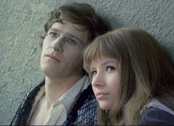 Movie still from “Valerie and Her Week of Wonders” (1970), directed by Jaromil Jires – A man and a woman leaning against a wall; Close Up shot, High angle