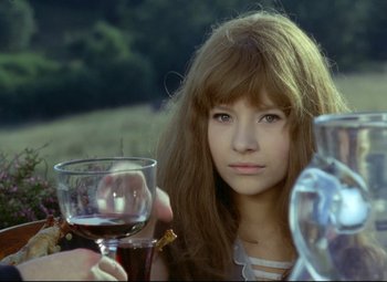Movie still from “Valerie and Her Week of Wonders” (1970), directed by Jaromil Jires – A woman holding a glass of wine in her hands; Close Up shot, Over the shoulder angle