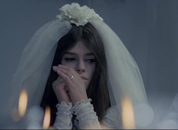 Movie still from “Valerie and Her Week of Wonders” (1970), directed by Jaromil Jires – A woman in a wedding dress with a veil; Close Up shot, High angle