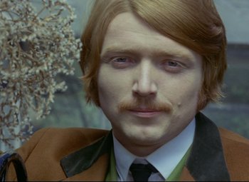 Movie still from “Valerie and Her Week of Wonders” (1970), directed by Jaromil Jires – A person wearing a suit and tie; Close Up shot, High angle