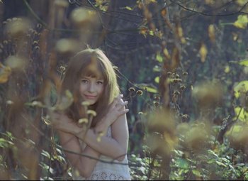 Movie still from “Valerie and Her Week of Wonders” (1970), directed by Jaromil Jires – A young girl standing in the middle of a forest; Medium shot, High angle