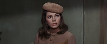 Movie still from “Valley of the Dolls” (1967), directed by Mark Robson – A woman wearing a hat and a brown jacket; Close Up shot, High angle