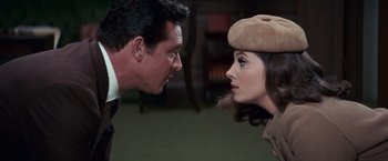 Movie still from “Valley of the Dolls” (1967), directed by Mark Robson – A man and a woman face to face in a room; Close Up shot, Over the shoulder angle