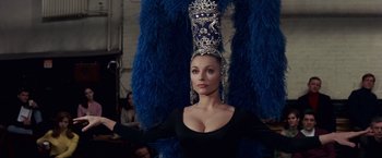 Movie still from “Valley of the Dolls” (1967), directed by Mark Robson – A woman in a black dress and a blue hat; Close Up shot, Low angle