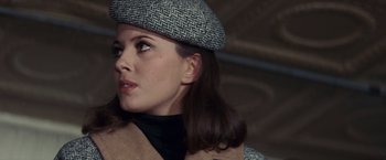 Movie still from “Valley of the Dolls” (1967), directed by Mark Robson – A person wearing a hat; Close Up shot, Over the shoulder angle