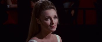 Movie still from “Valley of the Dolls” (1967), directed by Mark Robson – A person wearing a white dress; Close Up shot, Over the shoulder angle