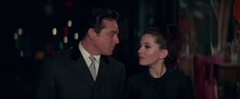 Movie still from “Valley of the Dolls” (1967), directed by Mark Robson – A man and a woman standing next to each other; Close Up shot, Low angle