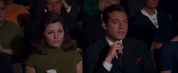Movie still from “Valley of the Dolls” (1967), directed by Mark Robson – A man and a woman sitting next to each other; Close Up shot, High angle