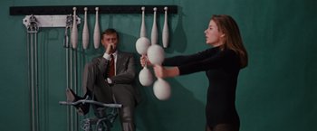 Movie still from “Valley of the Dolls” (1967), directed by Mark Robson – A man and a woman in a suit and tie; Medium shot, Over the shoulder angle