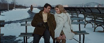 Movie still from “Valley of the Dolls” (1967), directed by Mark Robson – A man and a woman walking on a bench; Medium shot, Low angle