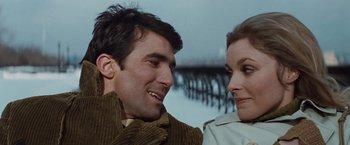 Movie still from “Valley of the Dolls” (1967), directed by Mark Robson – A man and a woman smiling at each other; Close Up shot, Low angle