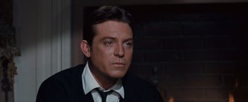 Movie still from “Valley of the Dolls” (1967), directed by Mark Robson – A person wearing a suit and tie; Close Up shot, Over the shoulder angle