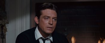 Movie still from “Valley of the Dolls” (1967), directed by Mark Robson – A person wearing a suit and tie; Close Up shot, Over the shoulder angle